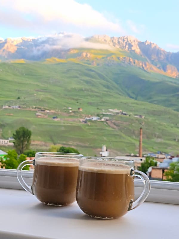 Coffee, cake, and Caucasus views from a mountain retreat