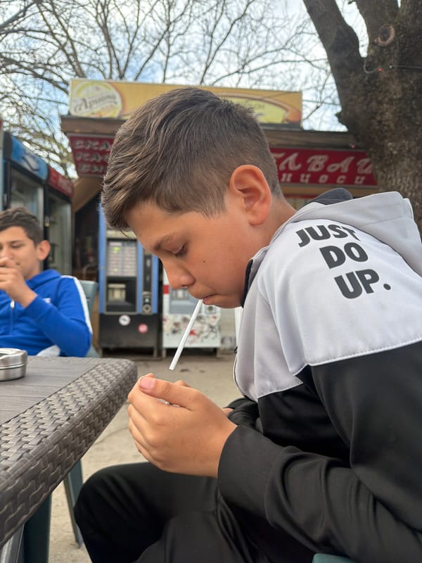 Young men gather at outdoor café in Zlatna Panega