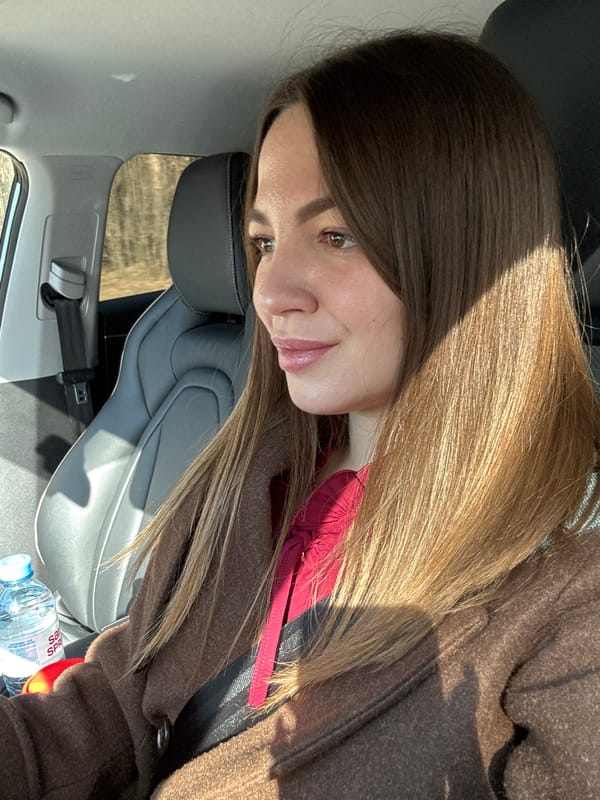 Woman in brown coat observed in car, Orekhovo-Zuyevo
