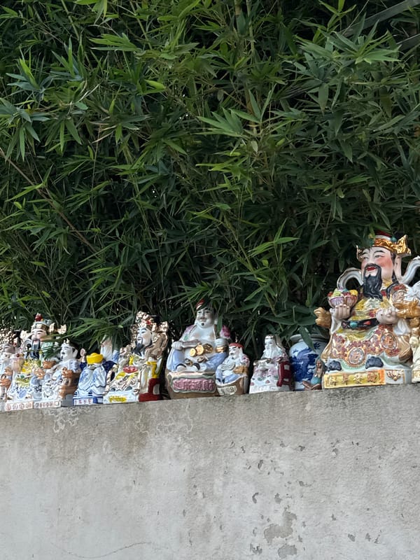 Morning riverside documentation captures religious artifacts and daily life in Hà Nội
