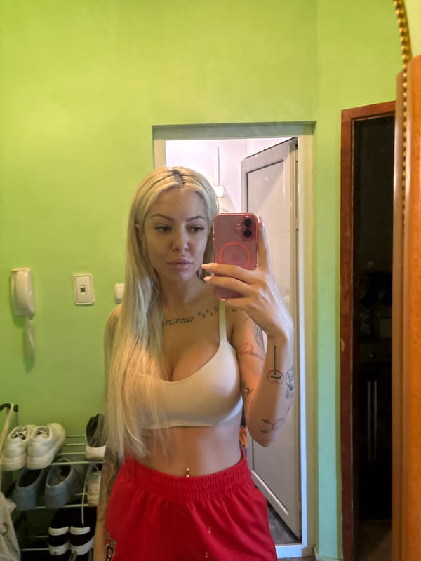 Woman takes selfie in green room in Plovdiv