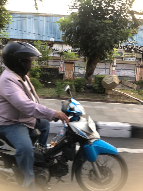 Morning traffic flow through a Larangan street intersection