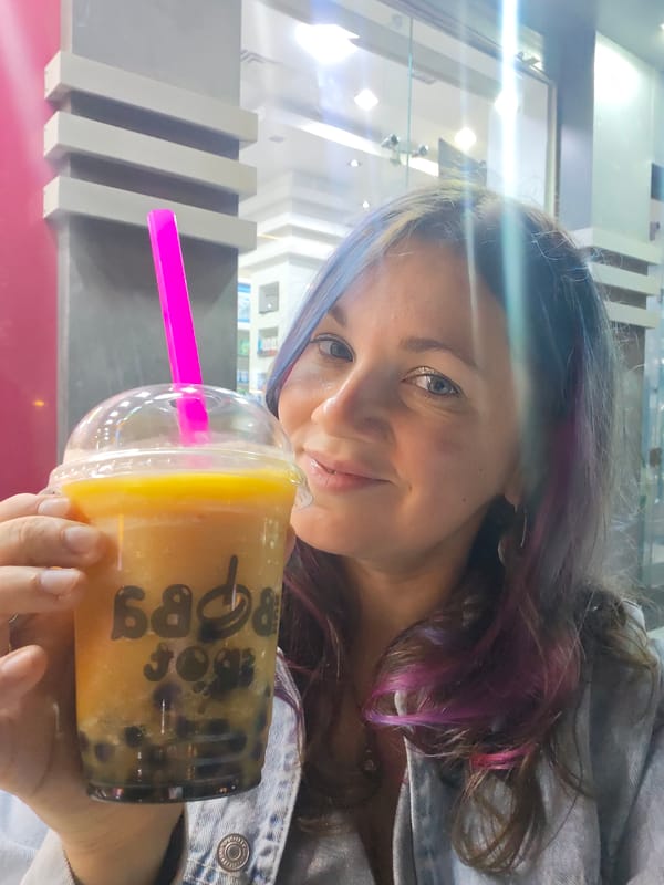 Woman enjoys boba tea at bubble tea shop in Hurghada
