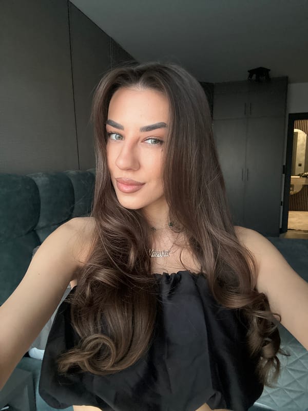 Woman takes mirror selfies in Sofia apartment bedroom