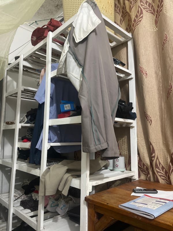 Clothing rack with folded garments observed in Dar es Salaam