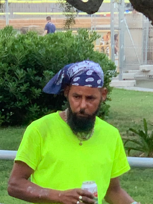 Man in green shirt spotted across Barcelona locations