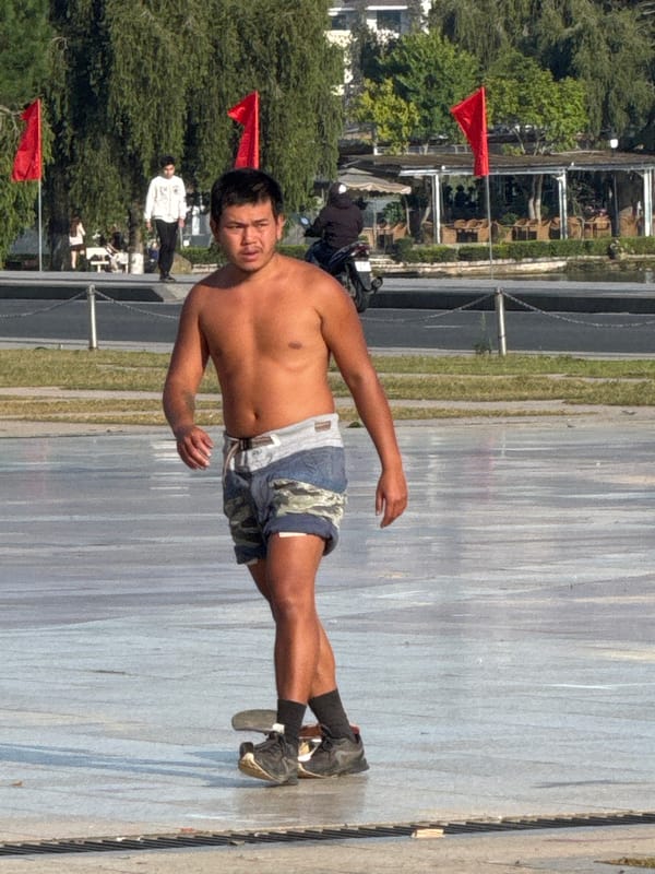 Da Lat plaza buzzing with skaters, flower motos, and street life