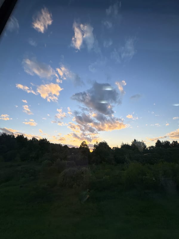 Golden hour skies captured over rural Belarus village