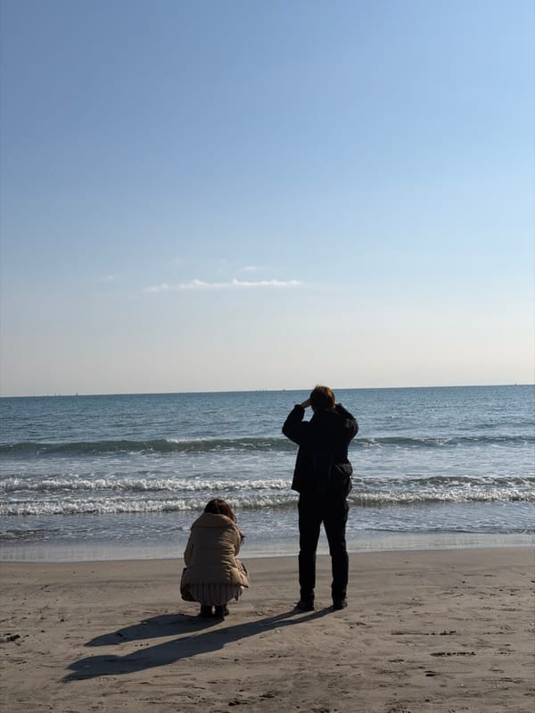 Two people observed at Kamakura beach during early morning hours