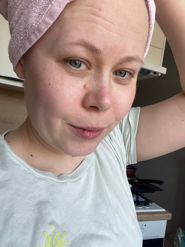 Woman takes selfie in pink towel in Chaikovsky