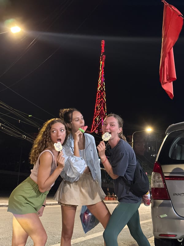 Tourist group enjoys ice cream, photos at illuminated Vietnam landmark