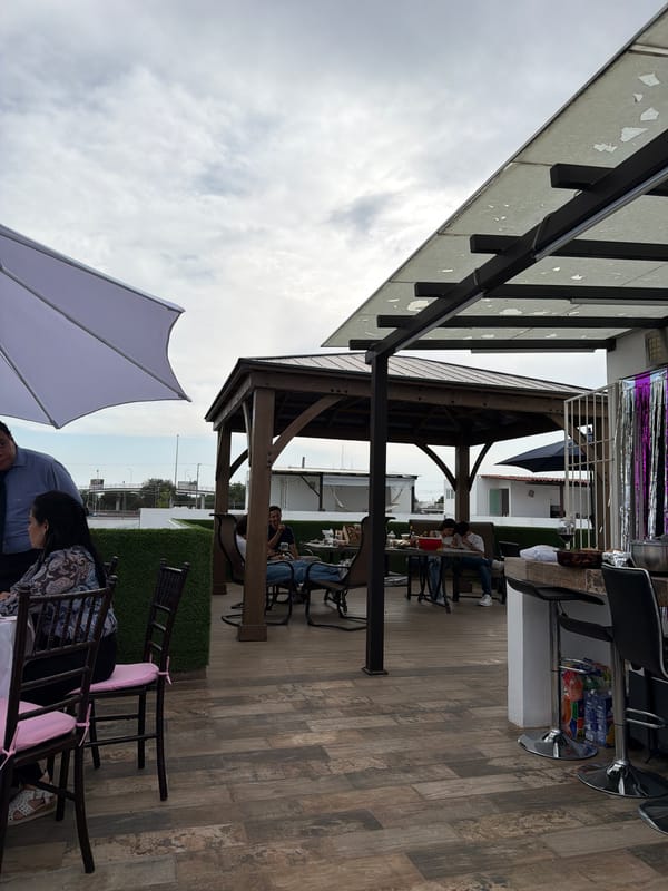 Outdoor patio with wooden flooring observed in Mexican town
