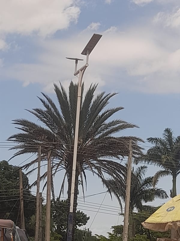 Midday street life along a Bukuru, Nigeria roadside
