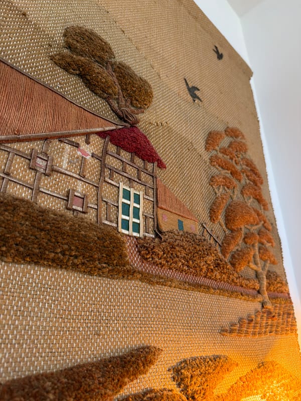 Embroidered tapestry showing Tudor house documented by witness