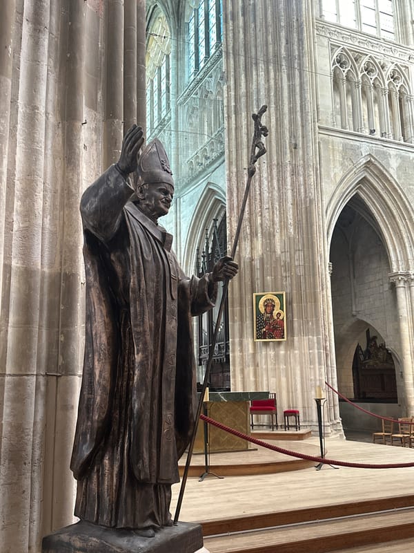Inside Saint-Jacques church, Dieppe — statues, organ, and memorial details