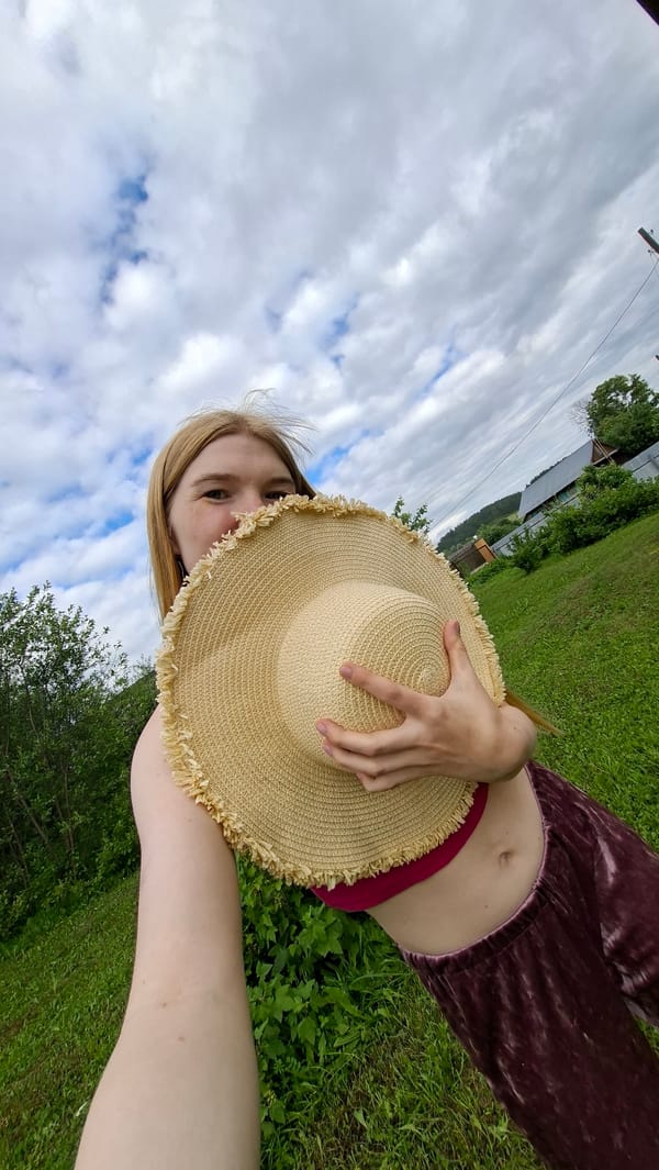 Woman documents spring garden photo session in Russian village