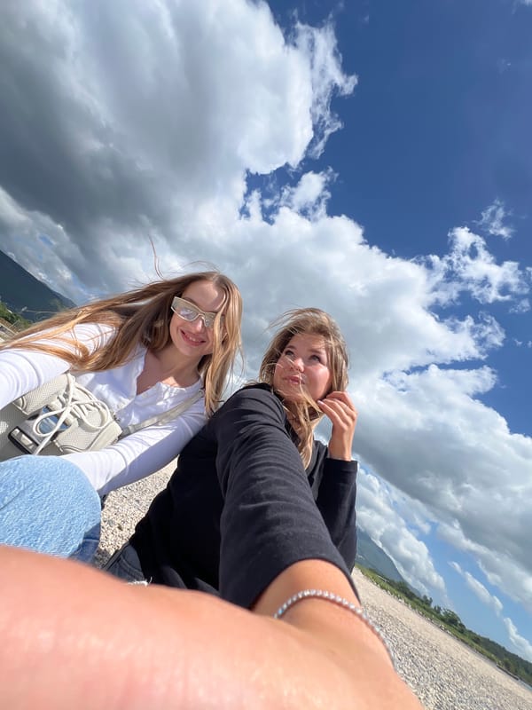 Two women take selfie on beach in Mrčevac, Montenegro