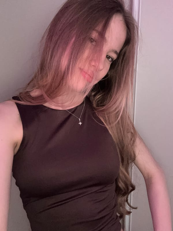 Woman takes multiple selfies indoors in Novoe Devyatkino