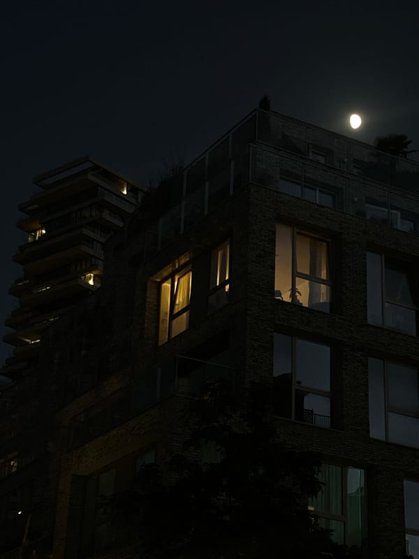 Amsterdam apartment building glows under full moon Monday night