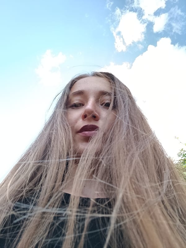 Backyard afternoon in Vypasne: cats, a duck, and selfies