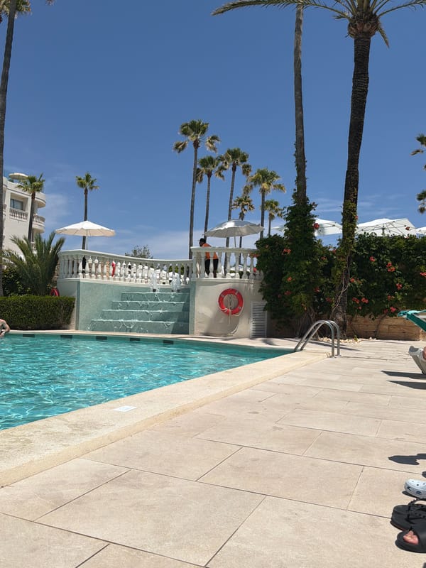 Sunny resort pool day in Alcúdia, Spain