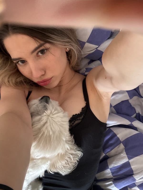 Woman takes selfies in bed in Noviy, Russia