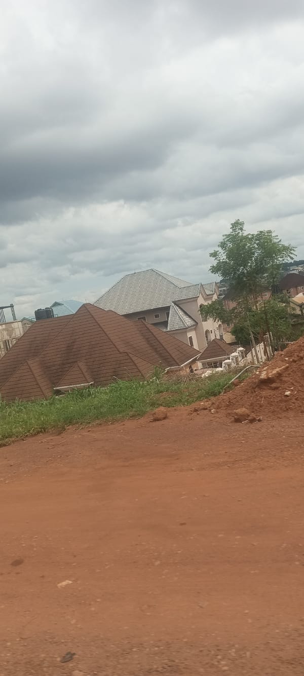 Residential construction documented in Enugu, Nigeria under overcast skies