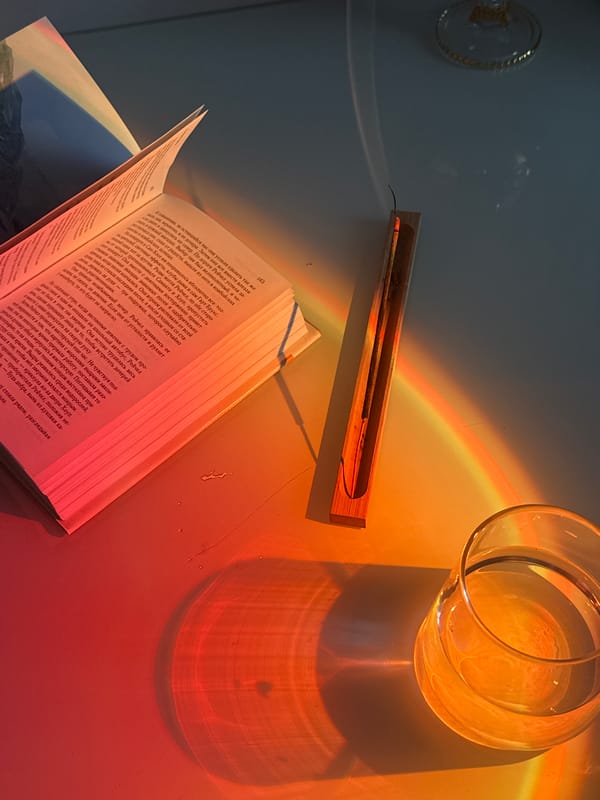 Quiet Reading Session Captured with Incense and Decorative Objects