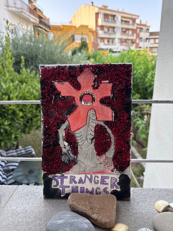 Balcony displays of art, toys, and plants in Blanes