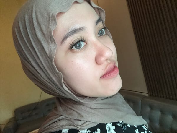 Woman in hijab recorded in residential setting, Gadingrejo