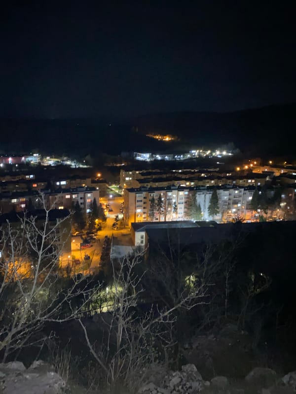 Aerial night view captures illuminated Veliko Tarnovo cityscape