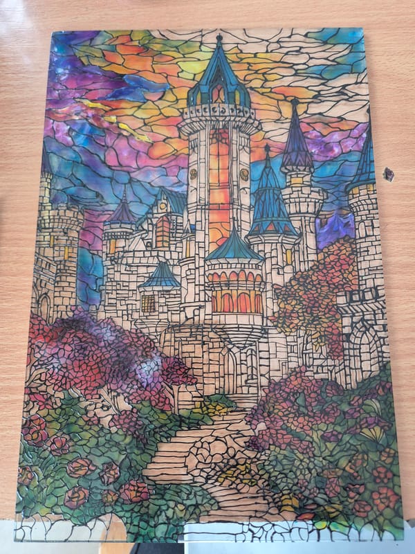 Stained-glass castle artwork spotted on clear surface in Bulgaria