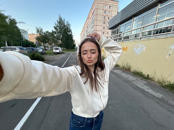 Afternoon out: selfies, a harnessed cat, and city streets