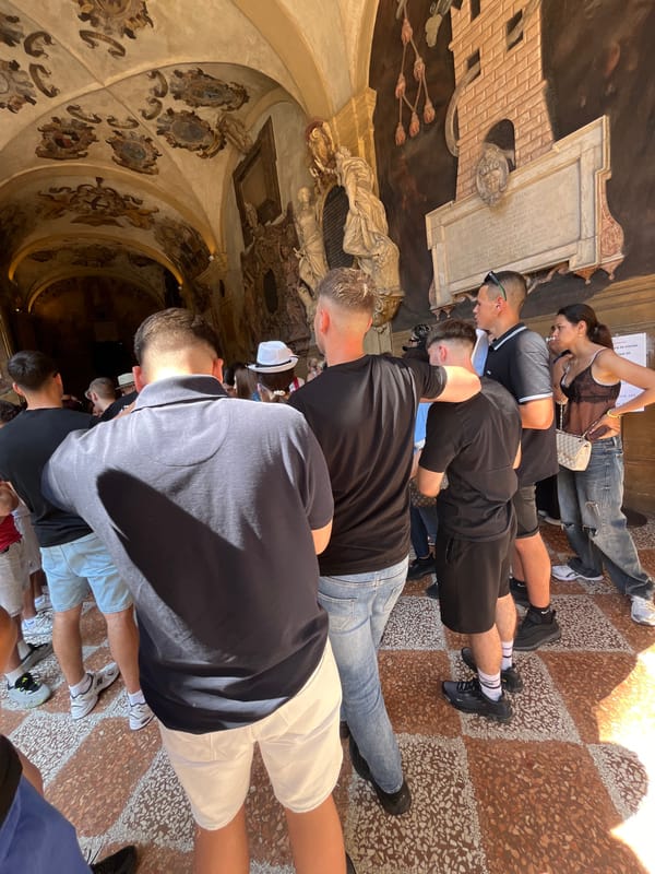 Tourists explore historic Bologna palaces during morning visit