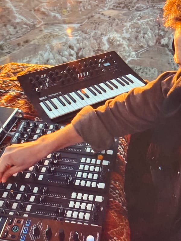 Live synth performance at a Baku amphitheater, hot air balloon included