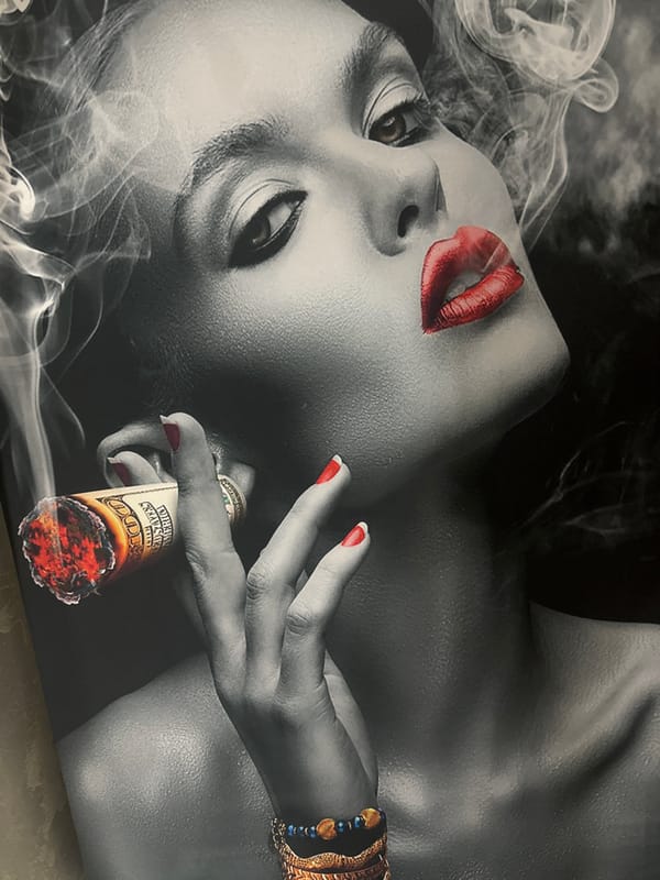 Woman smoking cigar observed at location 666