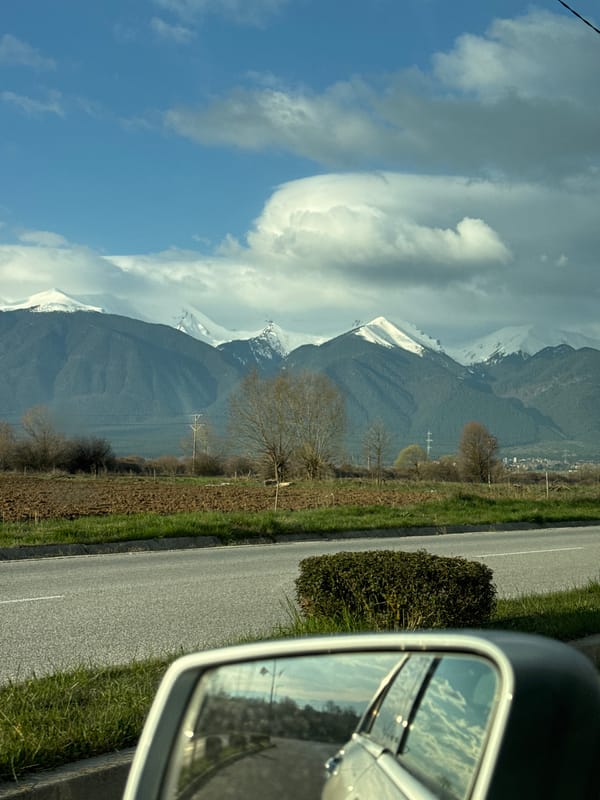 Early morning drive captures snowy peaks near Razlog, Bulgaria