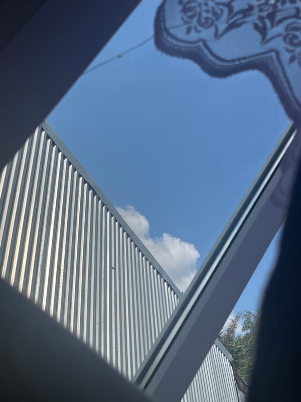 Corrugated building exterior and a colorful helmet in storage