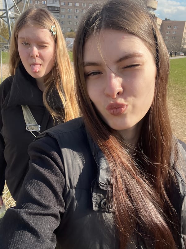 Friends photograph spring flowers during Saint Petersburg outing