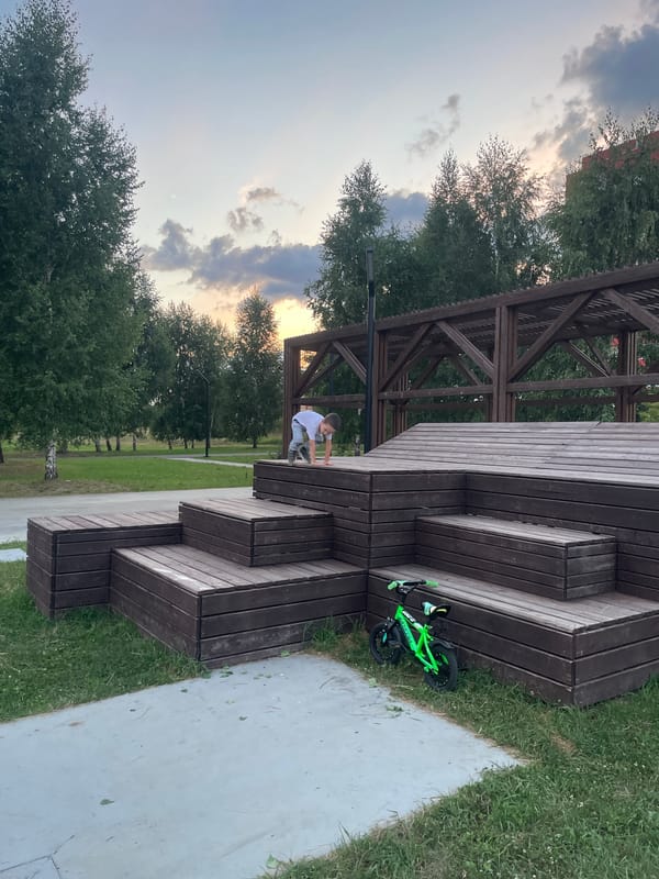 Summer evening at a Laishevo park with bikes and basketball