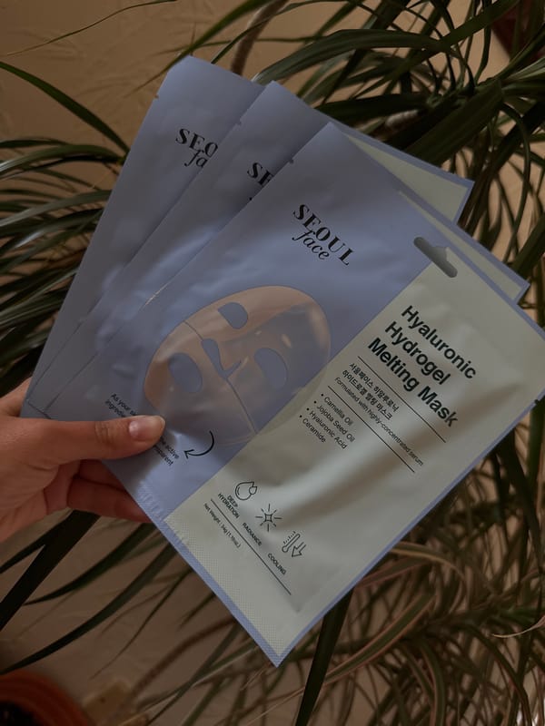 Person displays Korean skincare products in Leicester morning