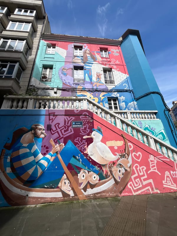 Colorful murals observed on tall building in A Coruña