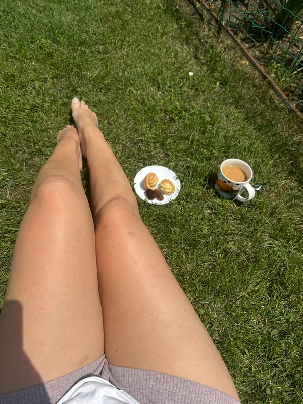Lazy morning in the garden with tea, snacks, and a cat