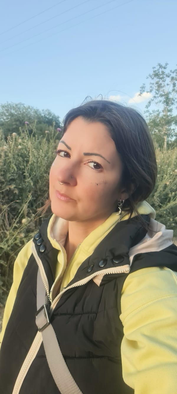 Woman in yellow outfit documented walking rural Israeli road