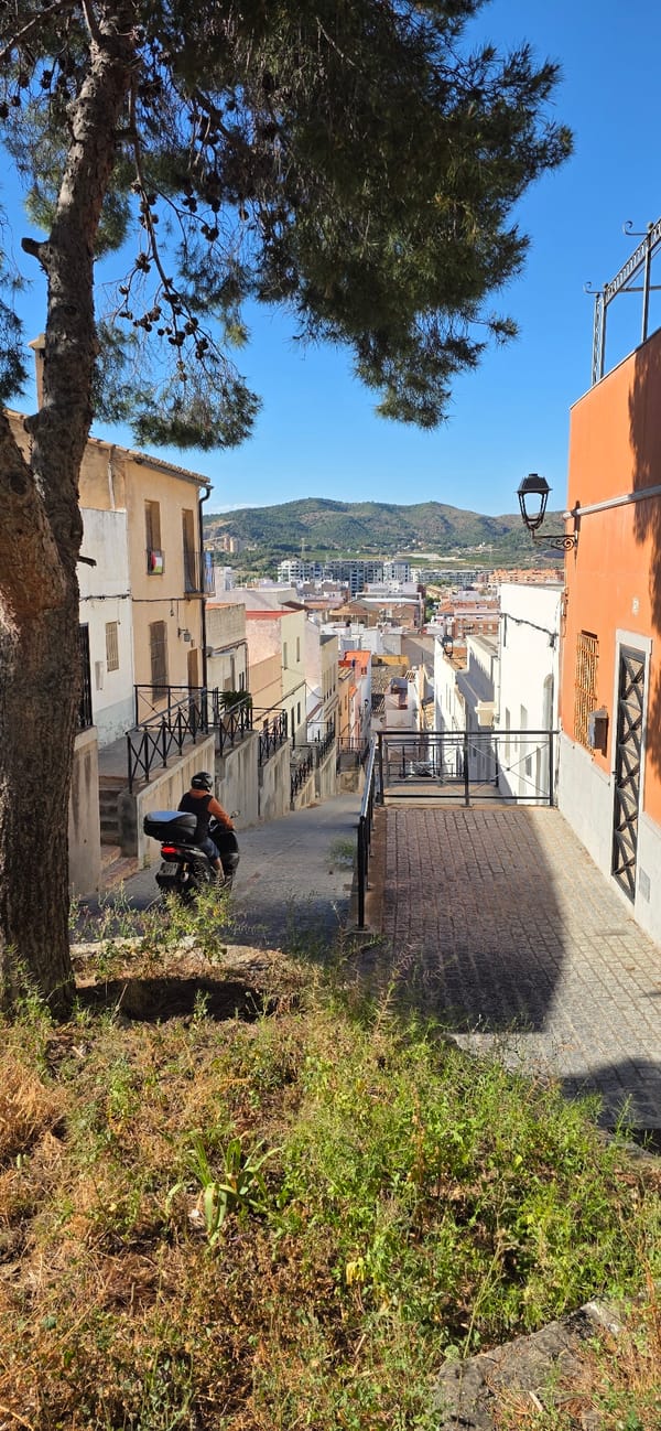 Tourist documents walking tour of historic Sagunto Castle Spain