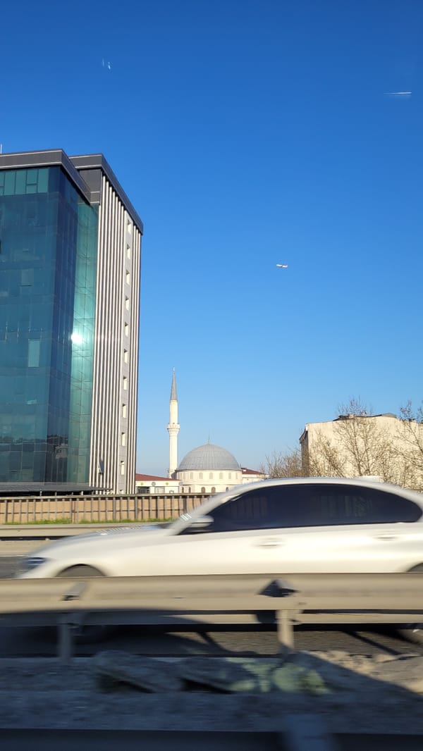 Aircraft spotted over Esenyurt residential district in clear skies