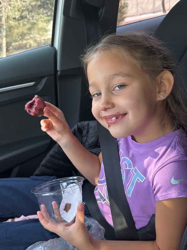 Child enjoys dessert in car in Krasnoyarsk