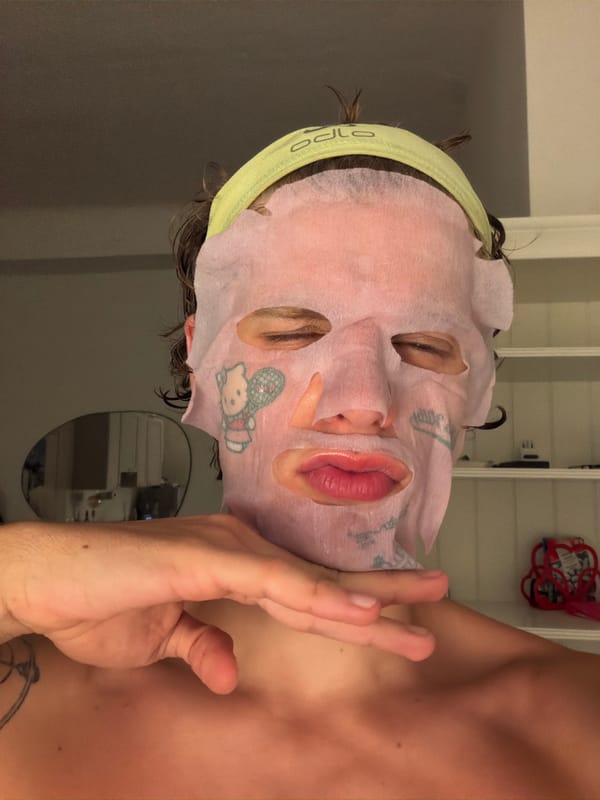Hello Kitty sheet mask situation in a dim Milan room