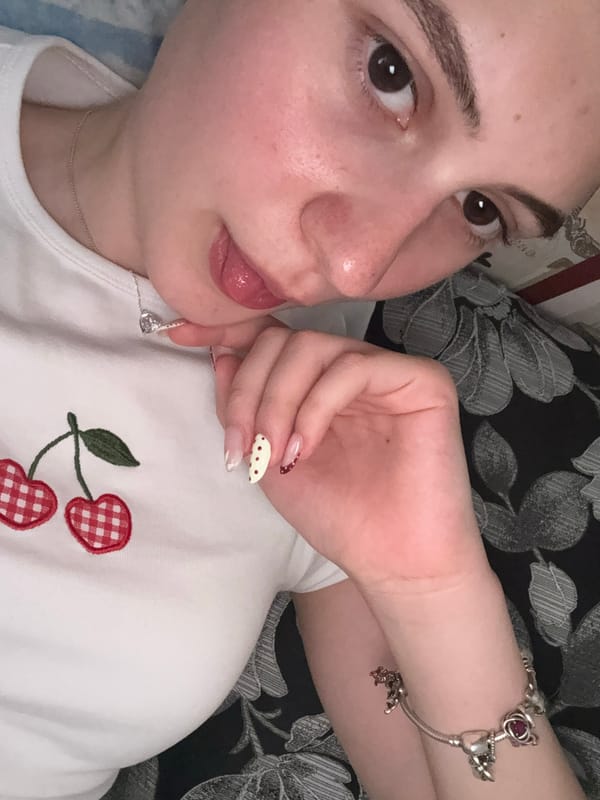 Young person takes casual selfies indoors in Panagyurishte