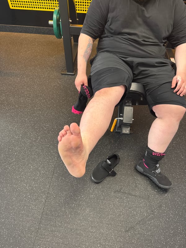 Men document weight training session at gym facility